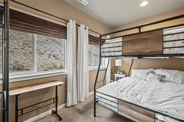 Main level 2nd bedroom faces to the privacy back hill. Blackout drapes for sleeping in.