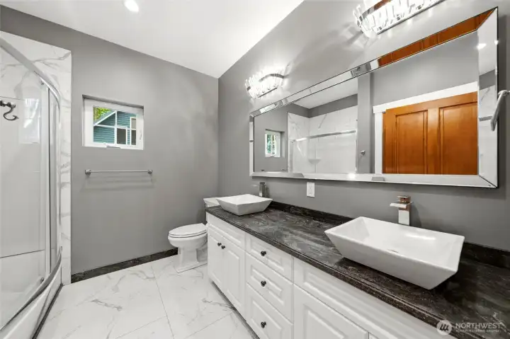 Main floor, full bath with heated floors & beautiful tile
