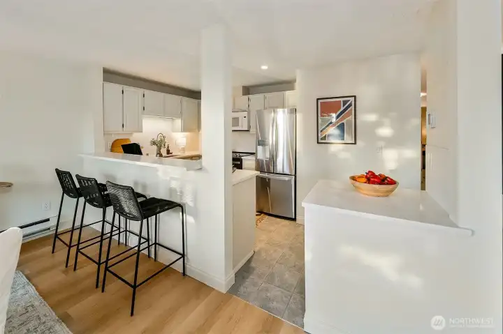 A row of upper cabinets were removed so those in the kitchen may also watch the setting sun across Lake Union.