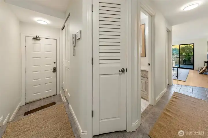 The front door and a look to the main living spaces.