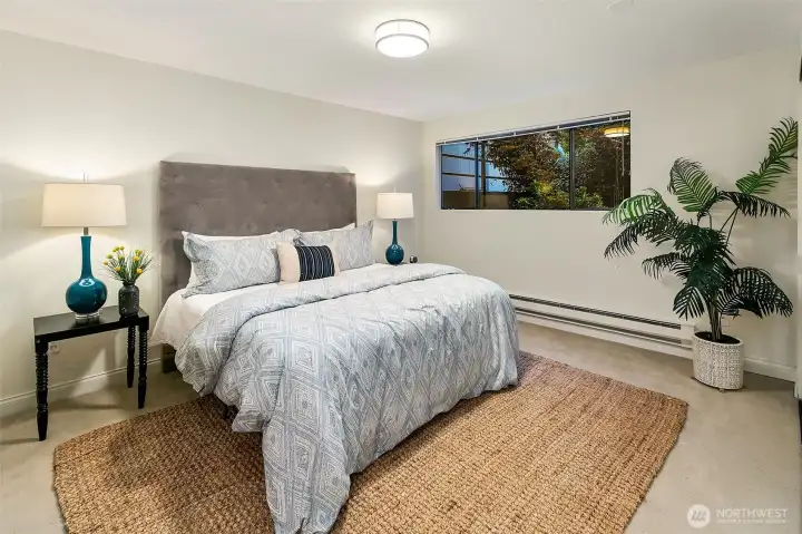 The primary suite is tucked away in the back corner for privacy, quiet and super cozy feel.