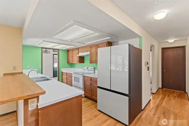 Open-concept kitchen featuring a seamless flow into the adjacent dining room.