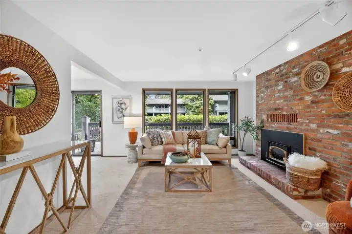 Cozy fireplace and floor to ceiling windows!