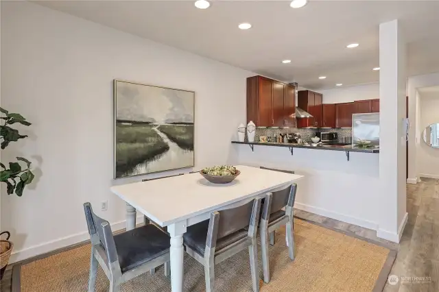 The dining area is ample allowing for an expandable table to seat guests at any special occasion.  Stools could also be added to the breakfast bar so the cook can be part of the conversation.