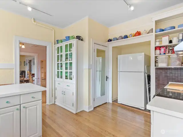 The original pantry closet is a beautiful focal point in the kitchen, and its twin is located in the lower level.