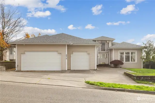 Sustainable living at its finest – solar panels, dual water heaters, a new heat pump, and EV/Tesla charger all included in this incredible home!