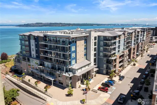 Luxury waterfront living in the Baker Building at Point Ruston.  Ground floor unit with walk out patio on Main Street.