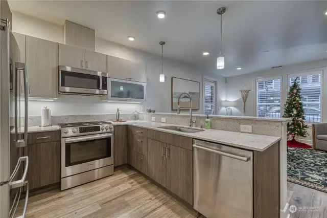 Modern kitchen with high end Bosch appliances and granite counters.