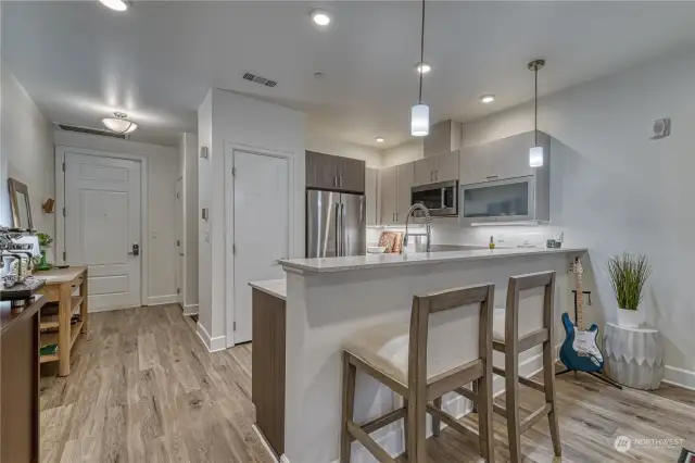 Kitchen is open to the living space with conevient counter seating.