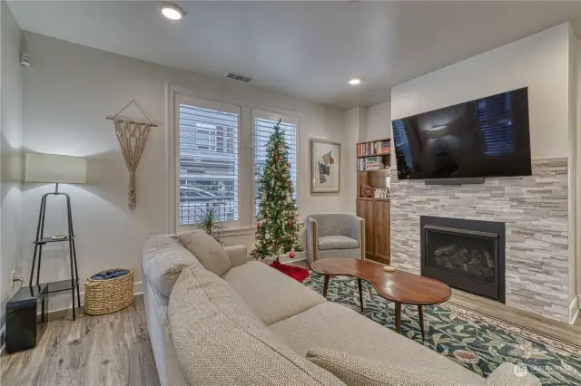 Gas fireplace with stacked stone surround adds a bit of warmth on a cool night.