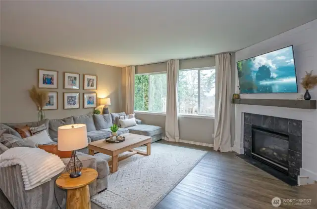 Cozy open concept family room with gas fireplace
