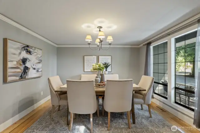 The large formal dining room with hardwood floors.