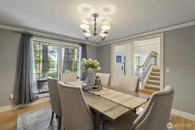 The large formal dining room with hardwood floors.