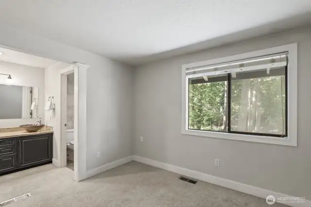 Upstairs primary bedroom with en-suite