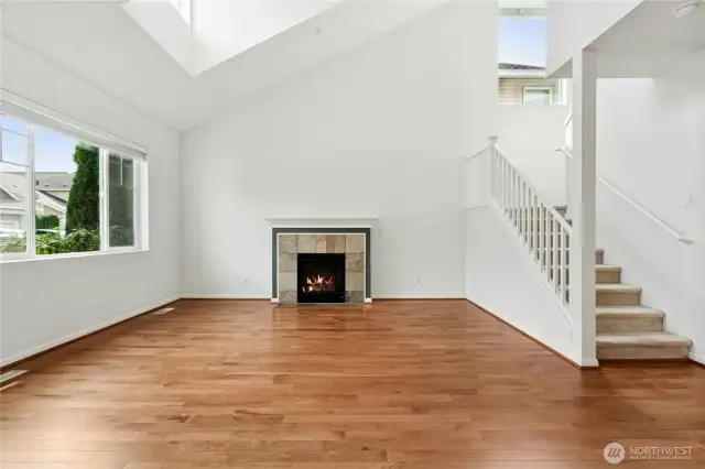 Living Room with Vaulted Ceilings and skylight