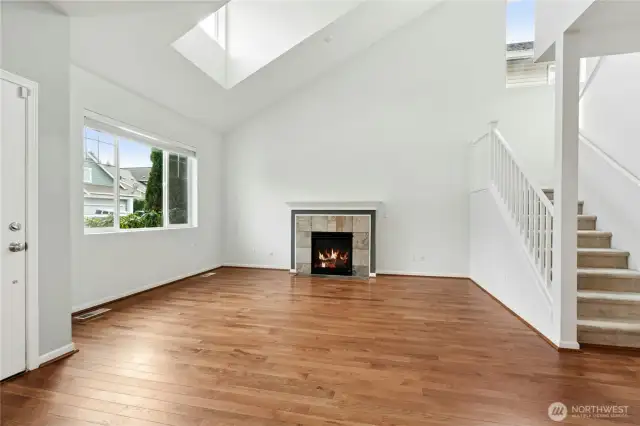 Living Room with Vaulted Ceilings and skylight
