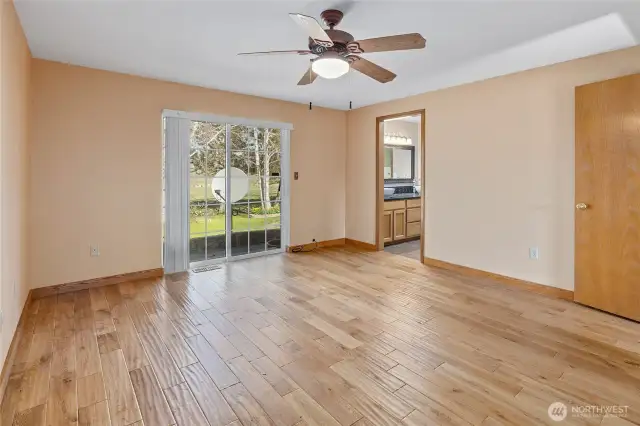 Primary bedroom with full bath and walk in closet.