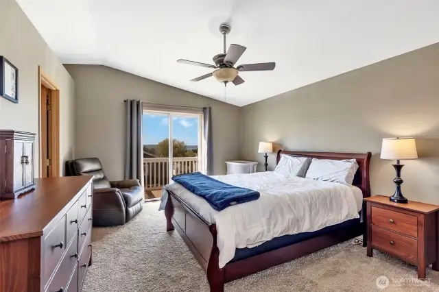 Primary bedroom with vaulted ceiling