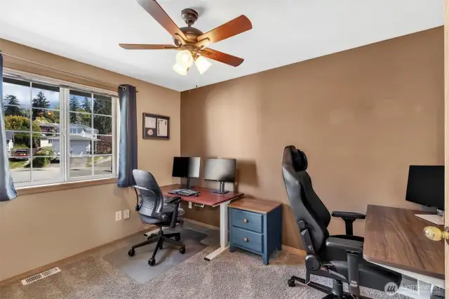 One of two bedrooms across from the primary