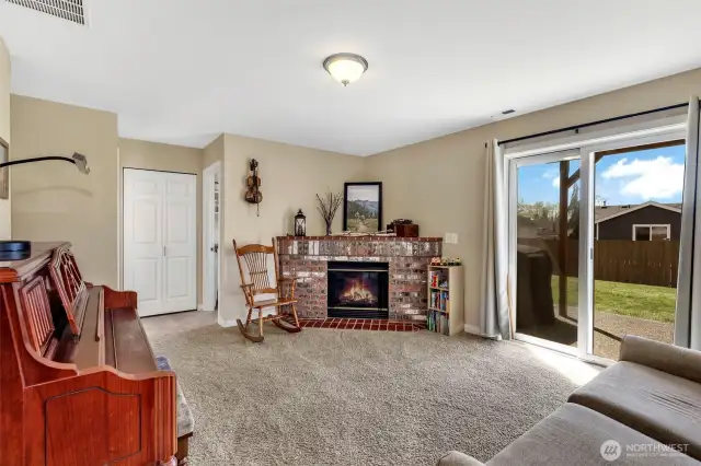 Sliding doors lead to the backyard