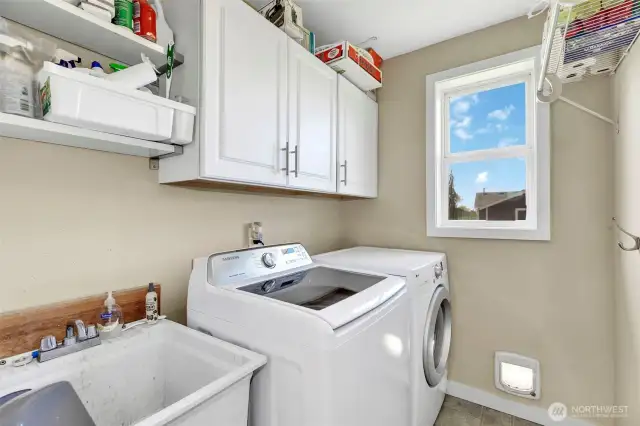 Laundry room with utility sink and great storage