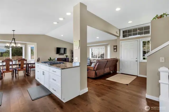 Main floor has engineered hardwood floors and vaulted ceilings