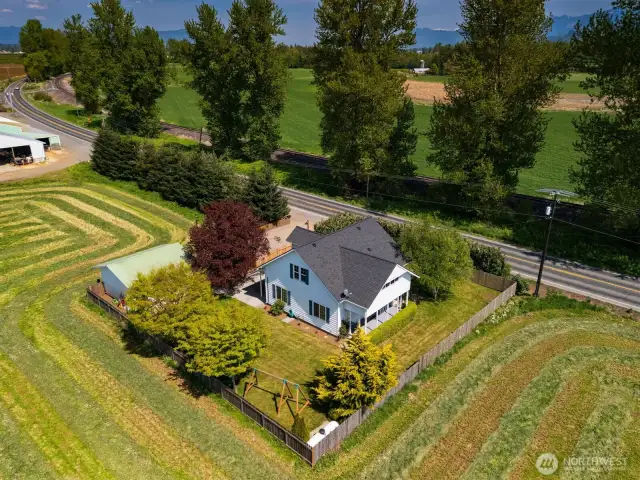 Charming farmhouse on a pristine property surrounded by open fields!