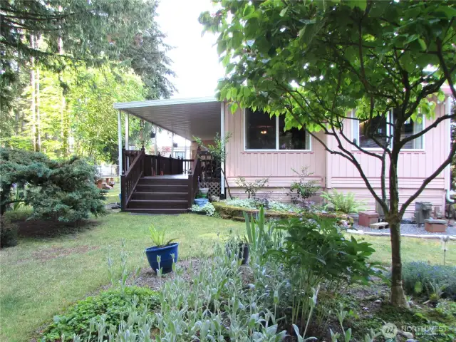 FANTASTIC SETTING!!!, FRONT DECK WITH A SWEEPING VIEW OF SILVER LAKE PARK (SULLIVAN PARK), AND LAKES SHORE JUST BEYOUND THE TREES.
