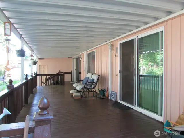 SLIDING GLASS DOOR ACCESSES LIVING ROOM.