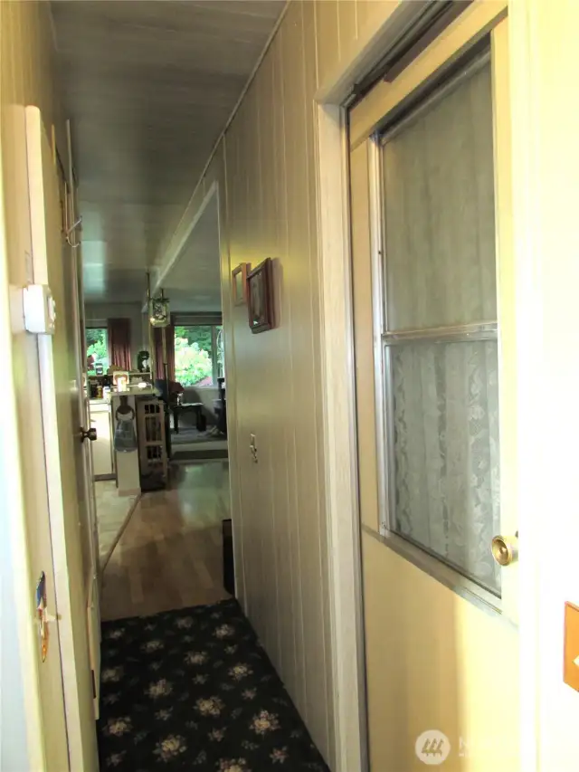 DOOR ACCESSES SPARE ROOM AND HAS SGD TO COVERED DECK.
