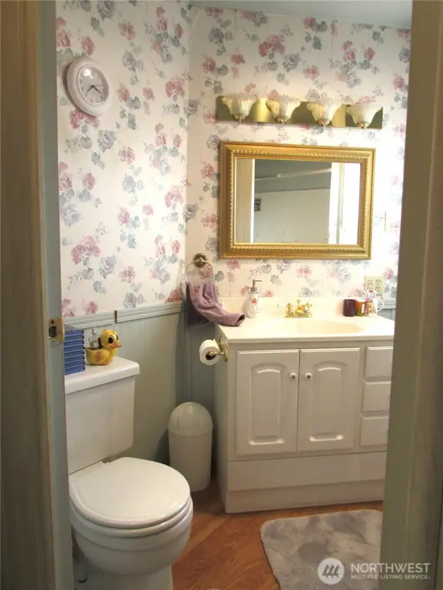 MAIN BATH HAS TUB/SHOWER TO RIGHT AND STROAGE CUBBOARD.