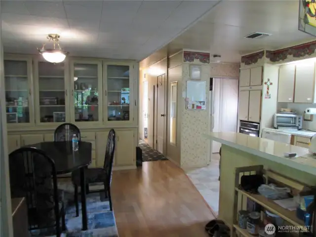 HALLWAY AND BACK DOOR TO LEFT WITH LAUNDRY AREA.