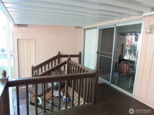 COVERED DECK STRETCHES ALMOST ACROSS ENTIRE HOMES. 2 SGD ETRIES INTO HOME OFF DECK.