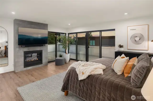 The primary suite is a serene retreat featuring private deck access.