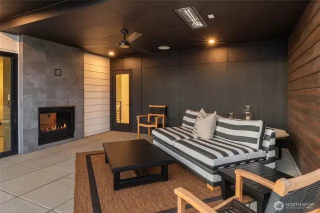 Deck of the primary with two-sided fireplace, and stunning views of Lake Washington and the Olympic Mountains.