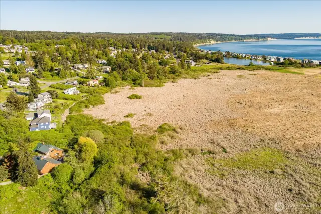 Aerial view near beach, second blue home on left.
