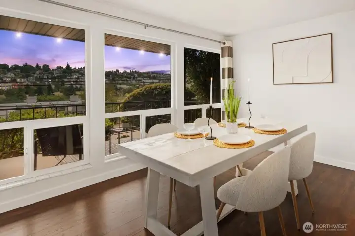 Enjoy sunset reflections off of Queen Anne hill from your new dining room.