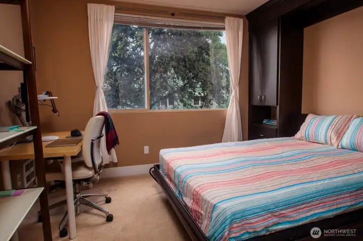 Second bedroom can serve as a home office and, with the Murphy bed down, comfy accomodations for overnight guests.