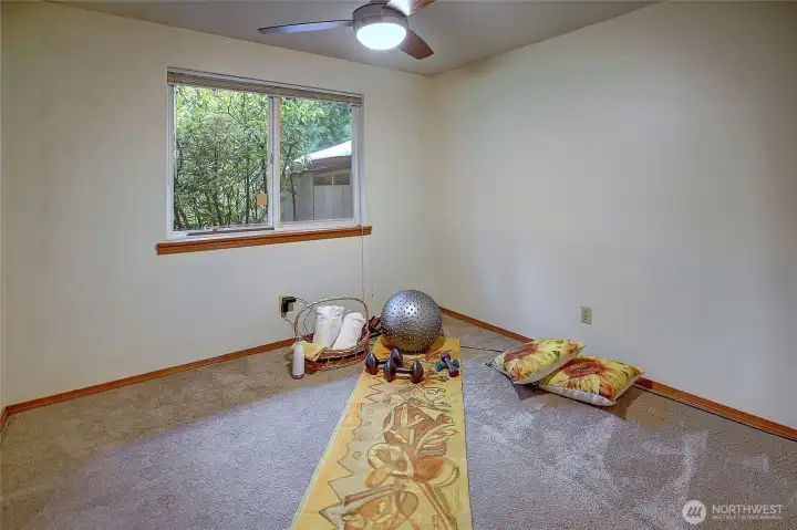 Bedroom. Generous closet, ceiling fan, supplemental wall heat & side yard view