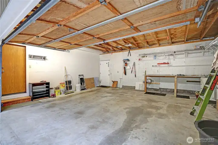 Workshop ready two car garage. Piping for fire suppression system. Generator subpanel.