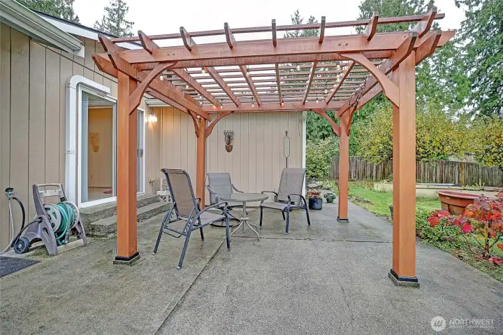 Generous covered patio for lounging and outdoor entertaining.