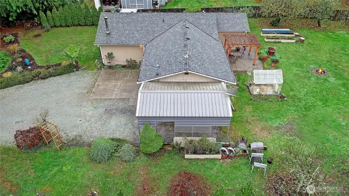 Covered RV parking. South garden view.