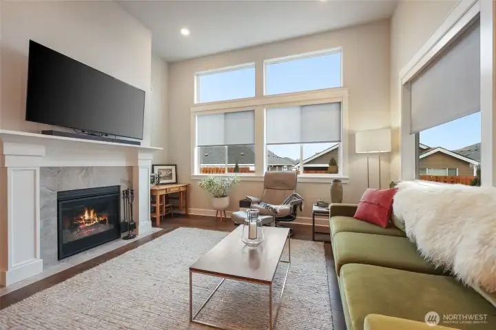 Electric shades, gas fireplace, recessed lighting, hardwood floors. white trim- modern luxury!
