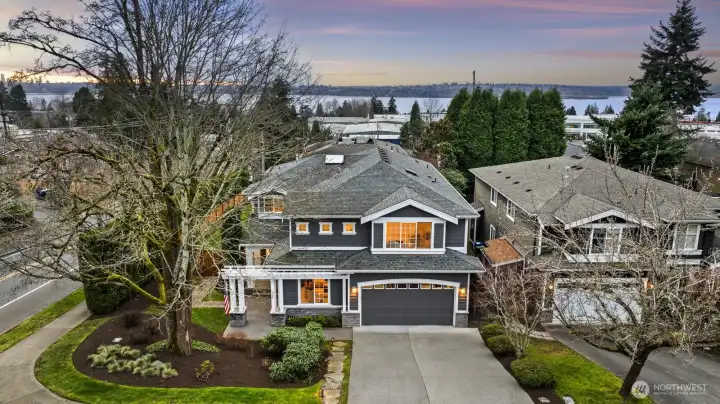 Commanding attention from a southern corner lot on a tree-lined street in coveted Kirkland, this craftsman is the dream home you've been searching for!