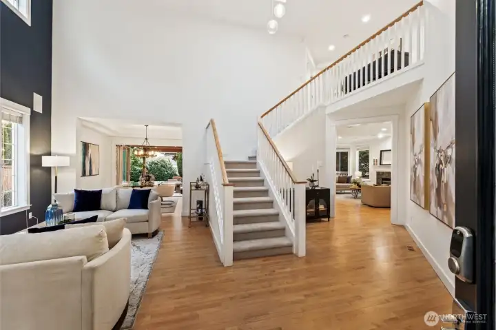 A grand two-story entry with soaring ceilings and skylights greets you as you step inside.
