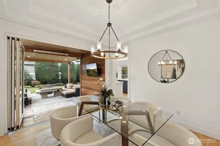 A custom Nanawall opens wide to expand the living spaces out onto the one-of-a-kind covered patio.