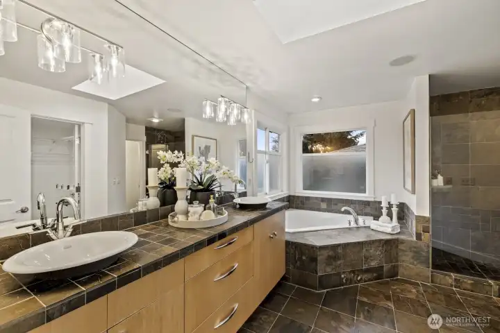 Start each day with a fresh face and a smile after getting ready in this beautifully appointed primary bathroom.