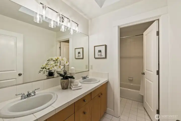 Full bathroom on the upper level with dual sinks and nice separation.