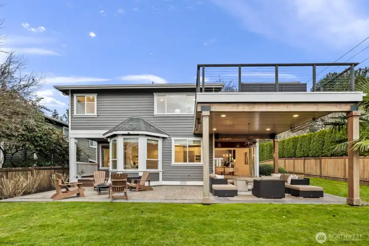 The covered patio is equipped with heaters, a fire pit and a TV (all included in the sale) and flows easily onto the sun-drenched portion of the patio for year-round enjoyment rain or shine.