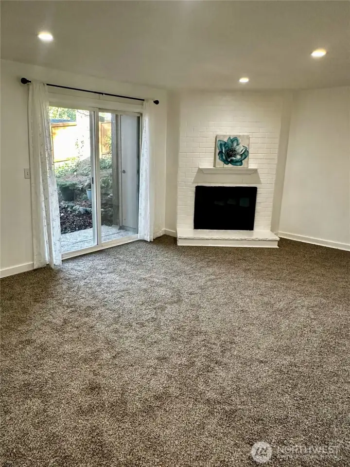 Spacious living room w/ cozy fireplace